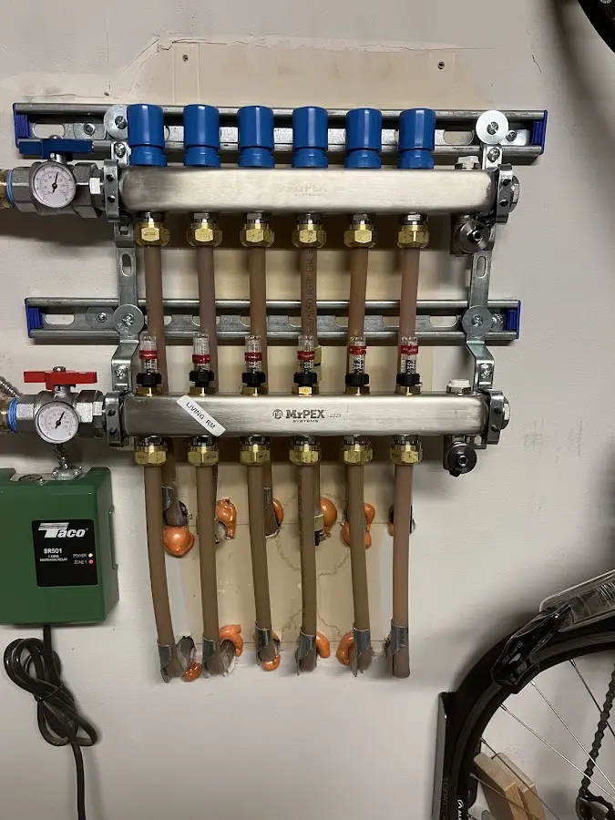 Plumber performing Water Heater Repair at a residential property in Pike Creek Valley